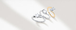 set of three different engagement rings with different styles and colours