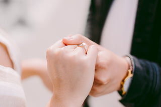 rose gold engagement ring on hand